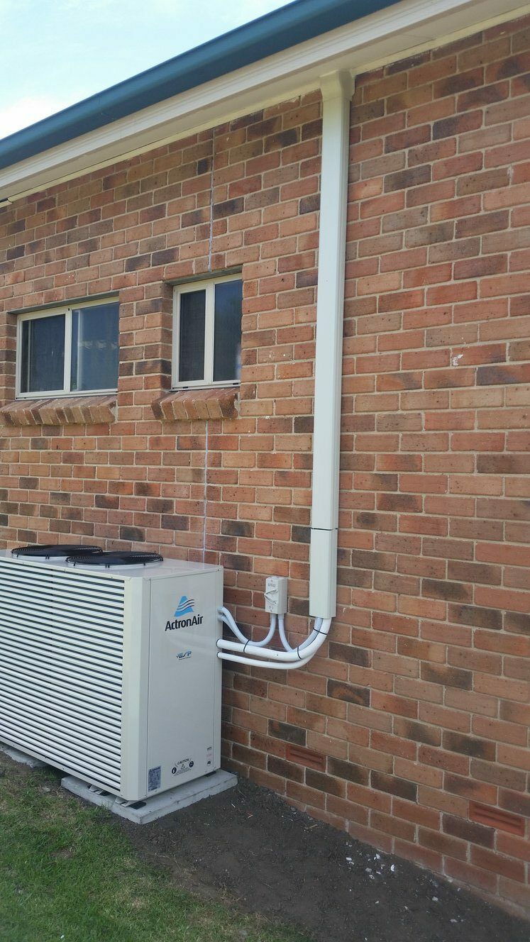 Shoalhaven Air Conditioning ActronAir outdoor unit brick wall
